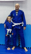 Jiu Jitsu practitioner holding his daughter